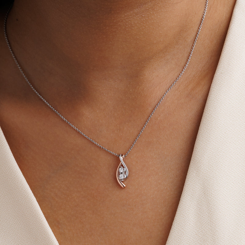 Teardrop swirl diamond pendant on chain, rose-gold inner curve with two round stones