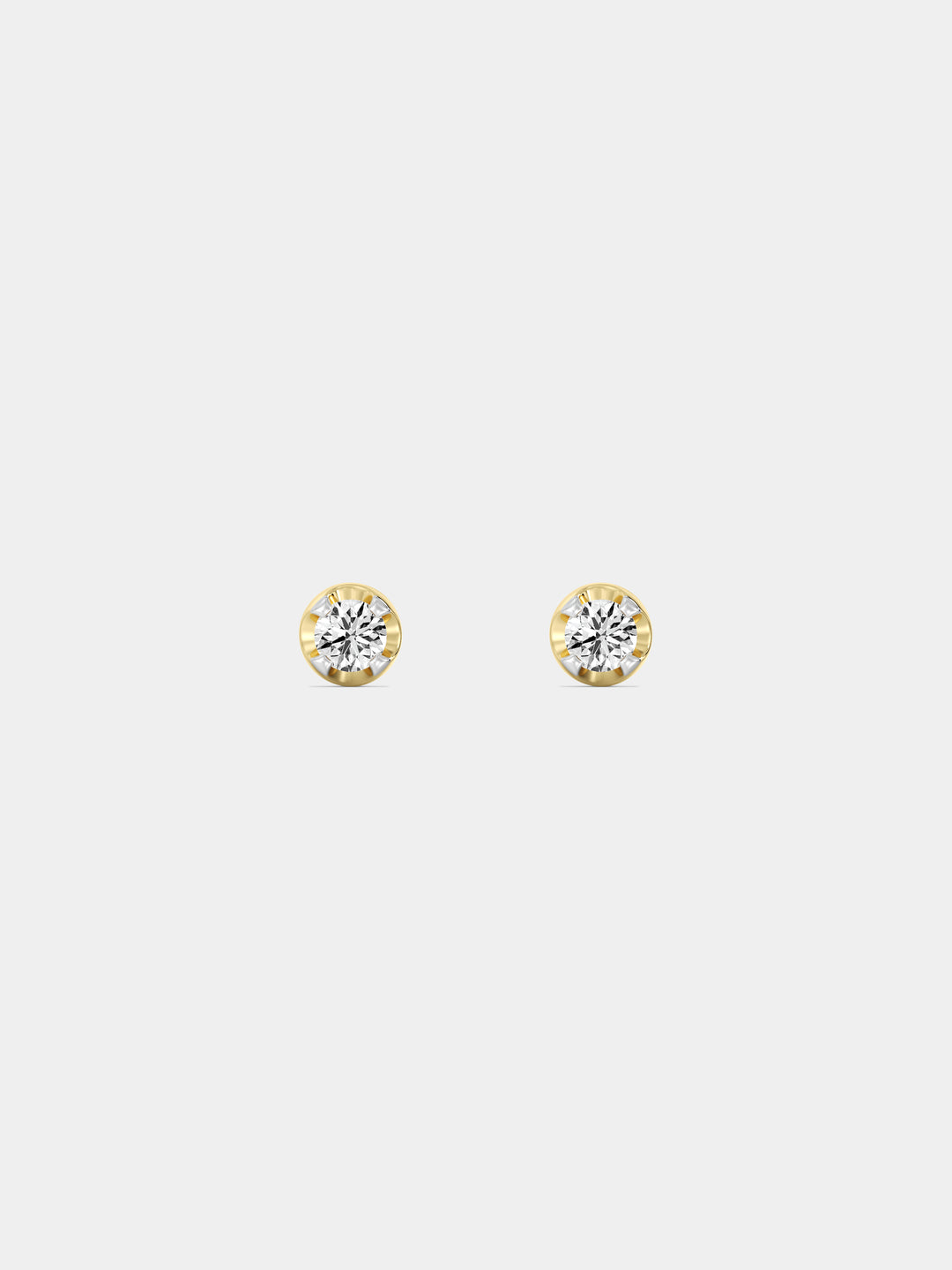 Keemti Jewels' Everyday Glow Solitaire Stud Earrings with round clear stones, shown front and side on white.