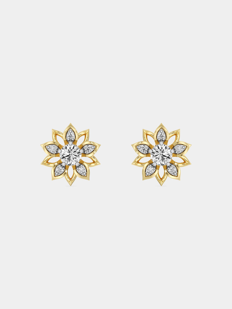A close-up of an ear wearing Keemti Jewels’ Golden Mirage Bloom Stud Earrings with clear gemstone and petal accents.
