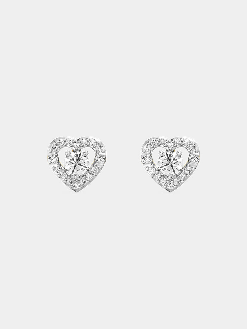 A close-up of an ear with brown hair wearing Keemti Jewels' Solitaire Center Stone Heart Stud Earrings.