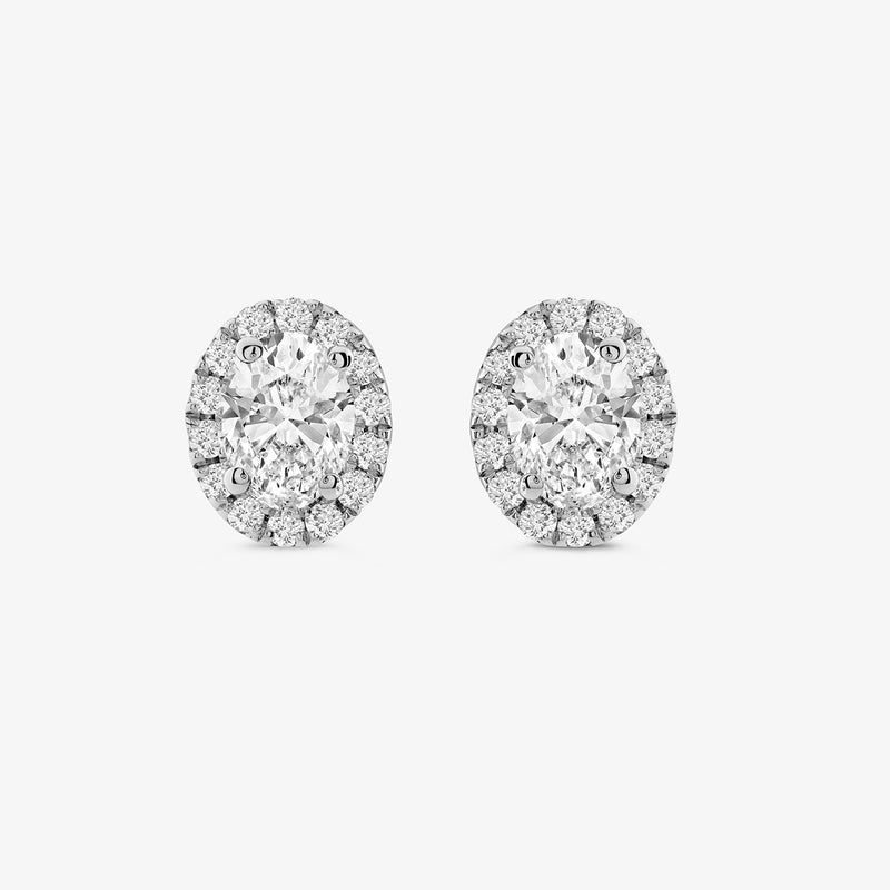 Classic Halo Solitaire Stud Earrings by Keemti Jewels feature sparkling round stones with a diamond halo on white background.
