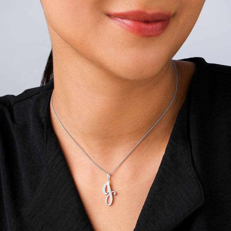 A woman in a black top wears the Keemti Jewels CLASSIC J Signature PENDANT for an elegant look.