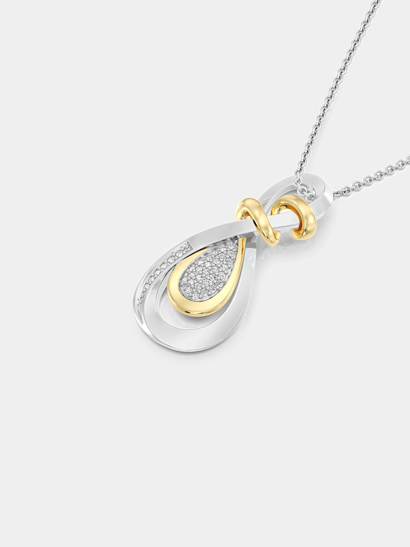 Necklet on neckline: teardrop pendant with gold accent and shimmering pave stones
