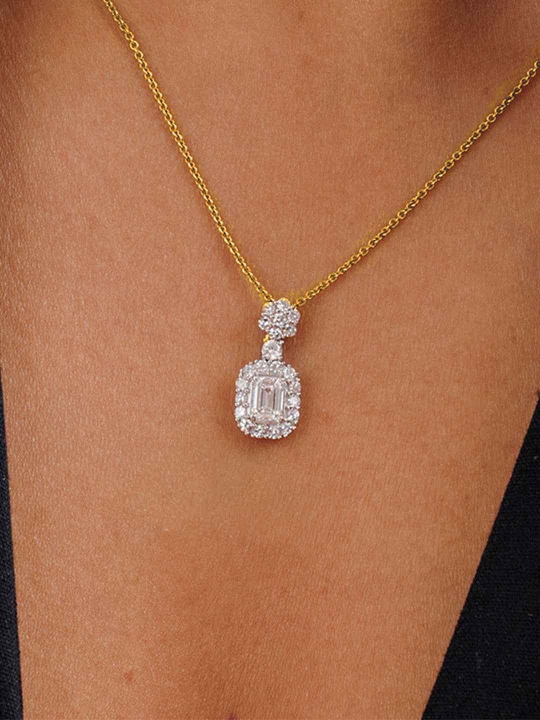 Keemti Jewels' Eternal Emerald Halo Necklet, featuring a delicate emerald pendant, shown on a plain white background.