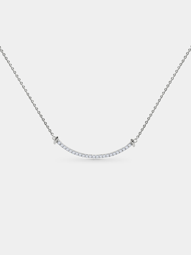 The Aurelia Arc Necklet by Keemti Jewels dazzles with a silver dual-tone bar and shimmering diamond accents.