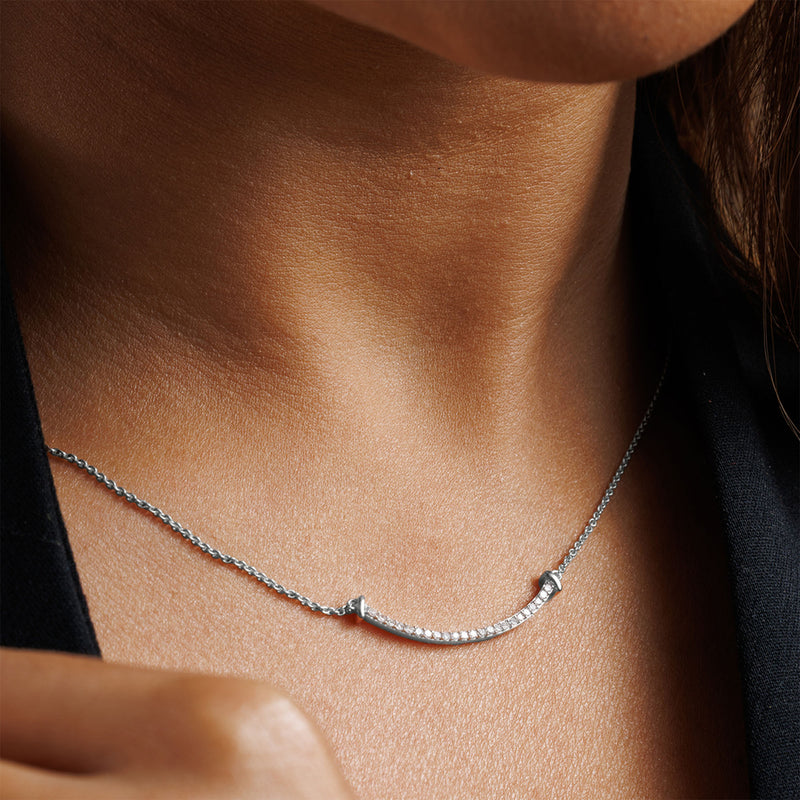 Aurelia Arc Necklet by Keemti Jewels: a curved bar pendant with diamond accents for modern sophistication.