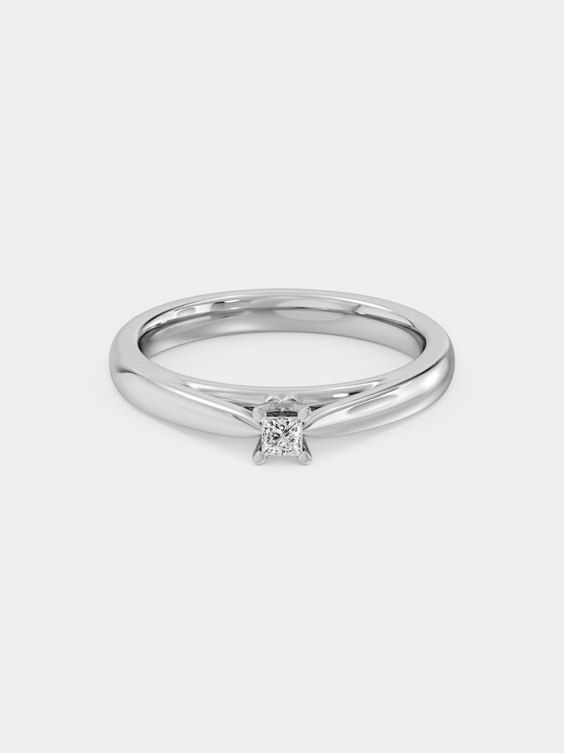 Side view: princess-cut diamond ring, central 4-prong stone, silver-tone band