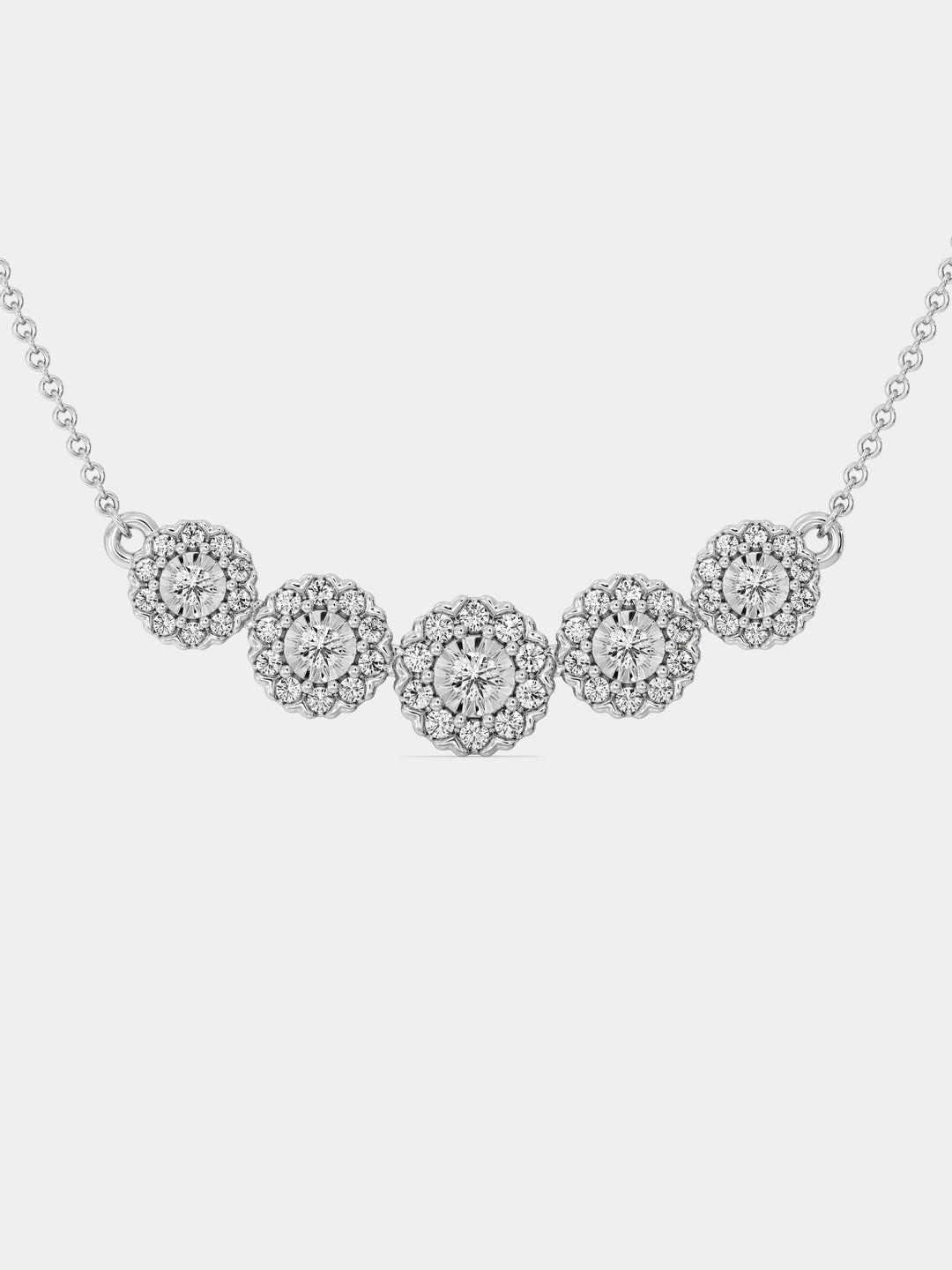 Silver-tone floral cluster necklace with round sparkling stone clusters