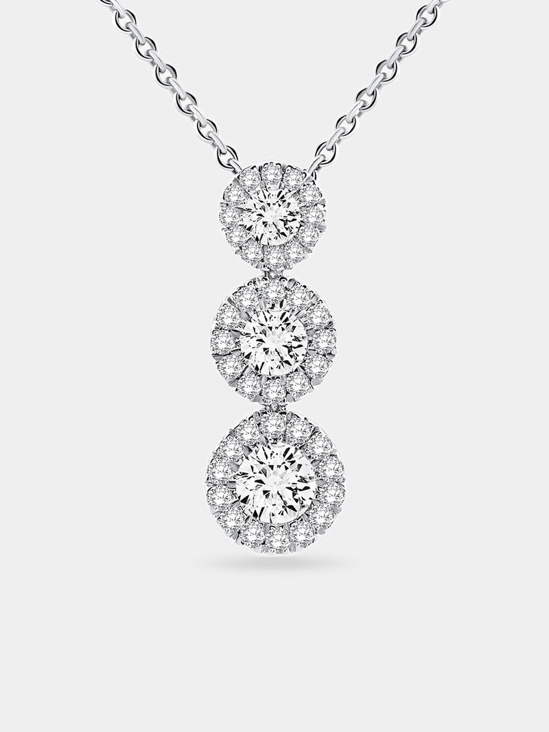 Silver three halo circles stacked on a cable chain pendant necklace.