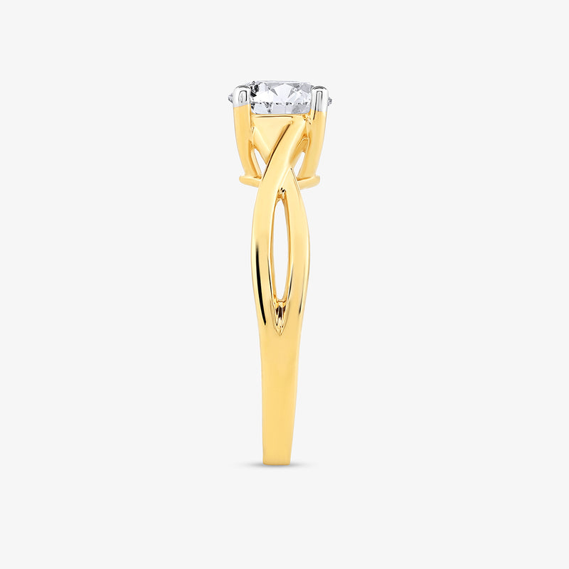 The Serene Swirl Solitaire Ring by Keemti Jewels features a twisted yellow gold band and prong-set center diamond.