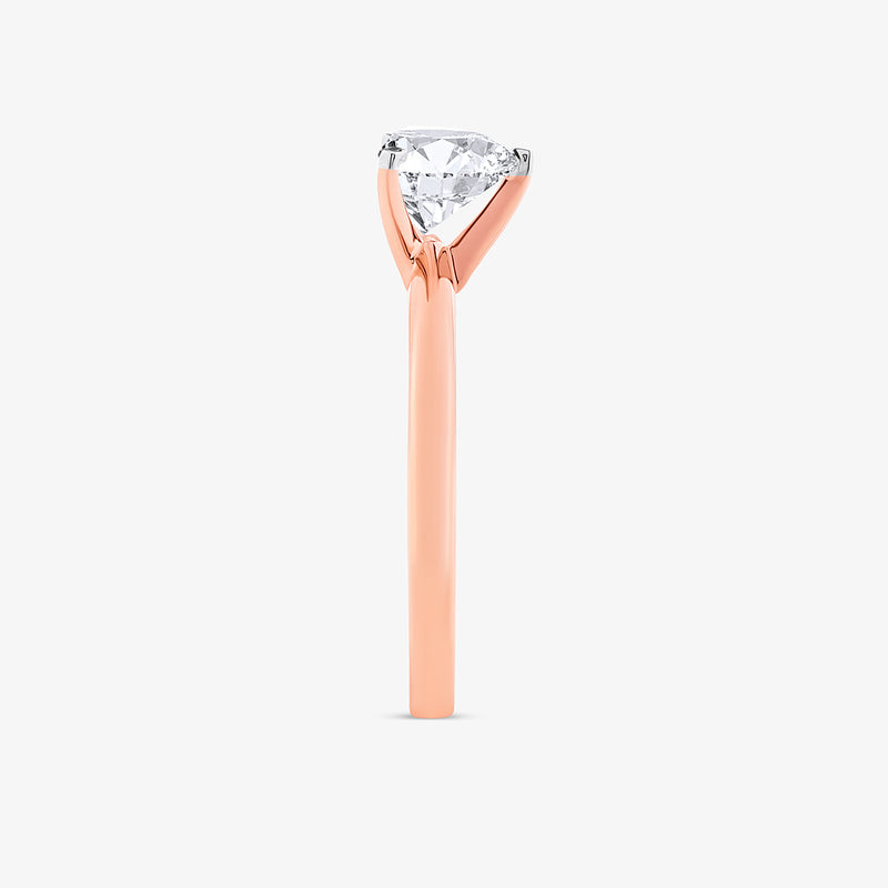 Keemti Jewels' Minimal Heart Solitaire Ring: rose gold, single round diamond in a classic prong setting, side view.