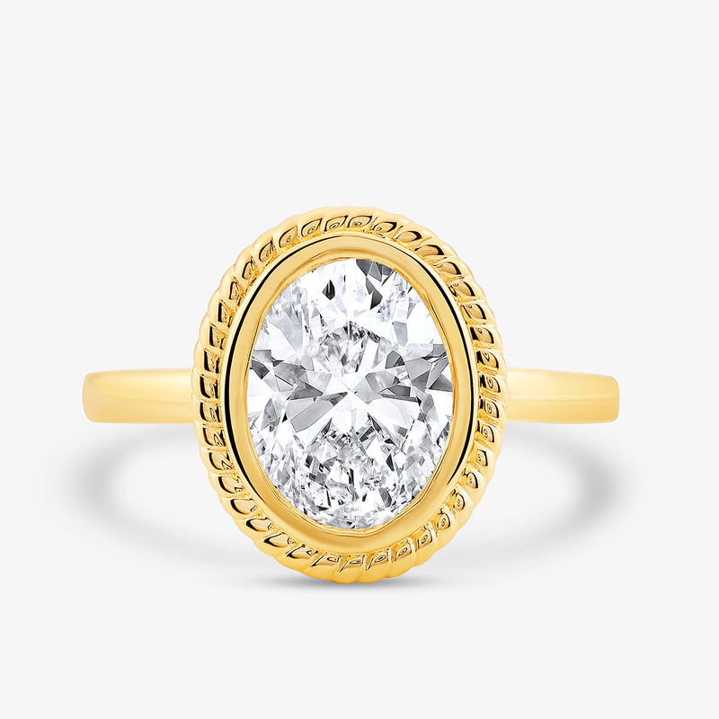 Keemti Jewels' Aura Rope Oval Diamond Ring features a large oval diamond and twisted bezel on a white background.