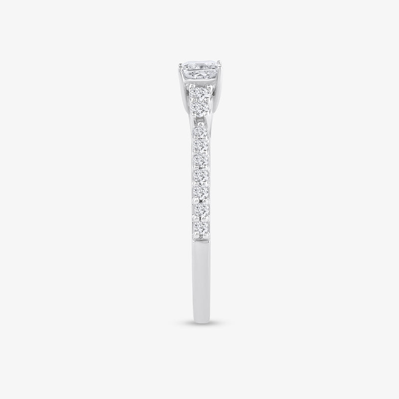 Side view of Keemti Jewels’ Timeless Princess Glow Ring in white gold with small diamonds  a princess-cut solitaire.