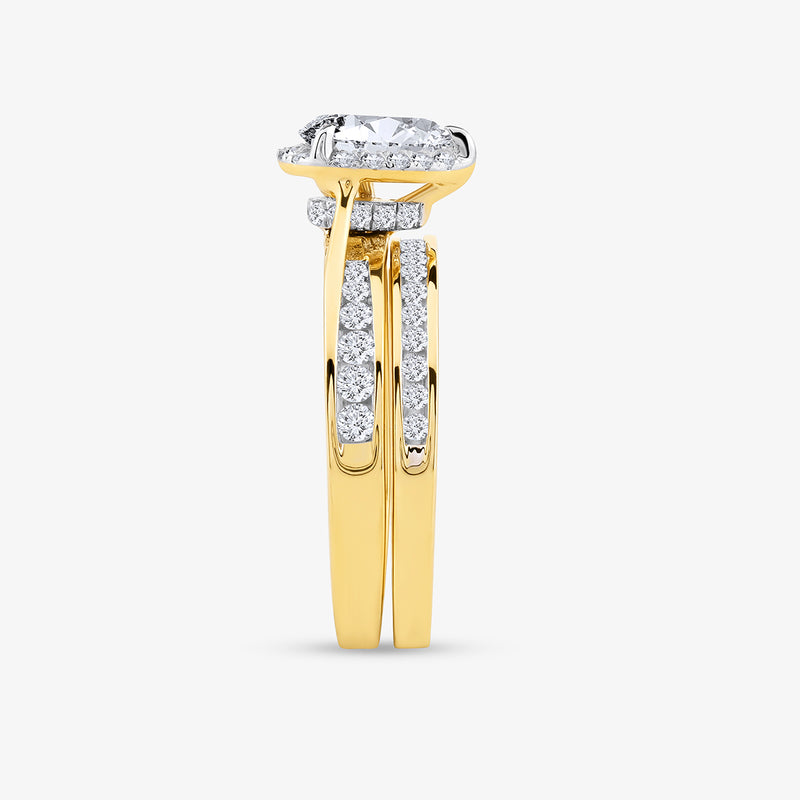 The Keemti Jewels Soft Glow Pear Diamond Solitaire Ring features a raised center diamond and side accent stones.