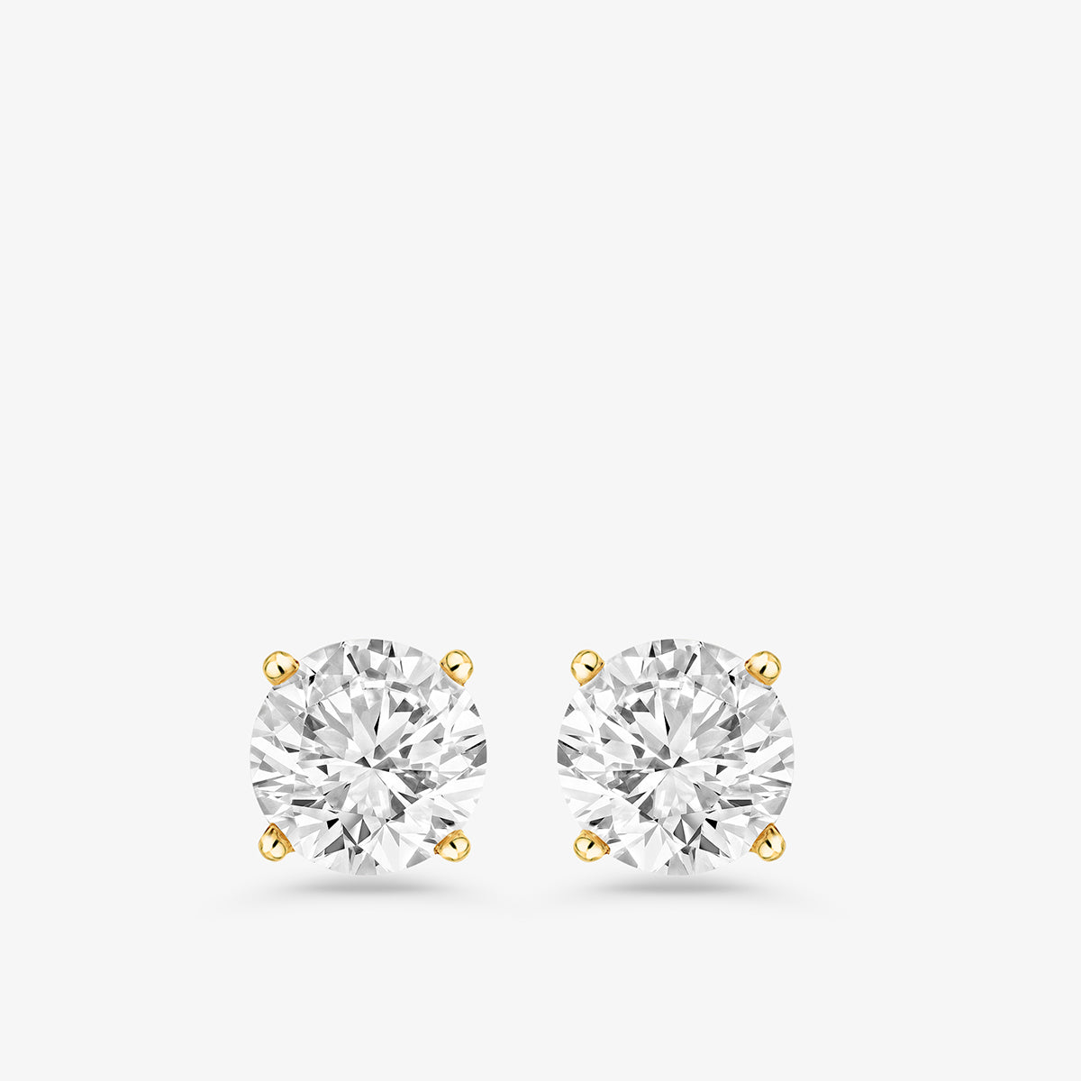 Timeless Solitaire Stud Earrings by Keemti Jewels feature a sparkling stone in a four-prong setting on white background.