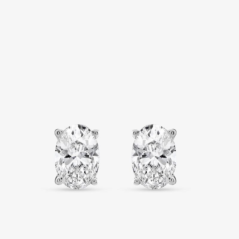 Keemti Jewels TIMELESS Oval Solitaire Stud Earrings in white metal, classic design on a plain white background.