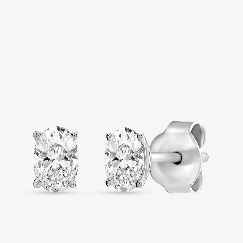 Keemti Jewels TIMELESS Oval Solitaire Stud Earrings with silver prongs and butterfly backs—an elegant accessory.