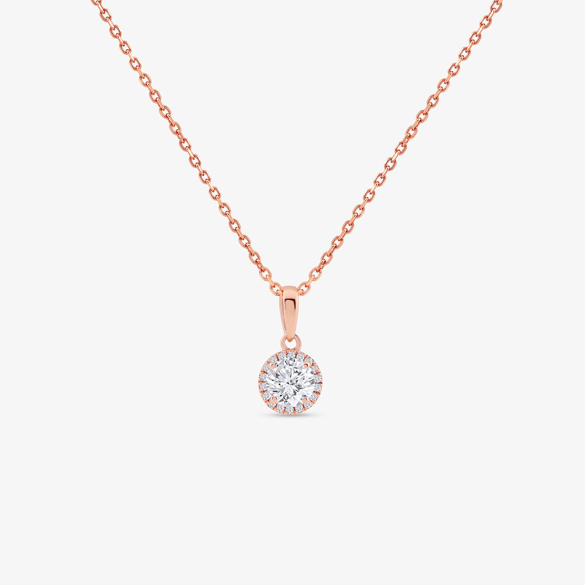 The AURELIA Round Halo NECKLET by Keemti Jewels adds everyday elegance with its rose gold chain and halo pendant.