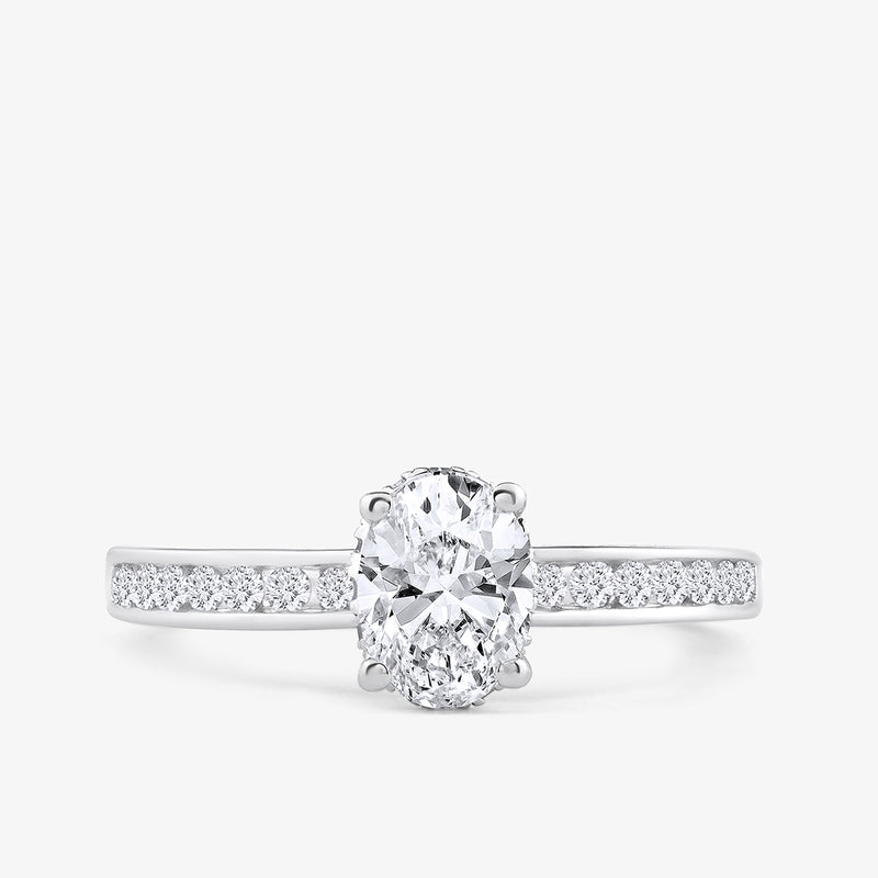 The Oval Grace Solitaire Ring by Keemti Jewels features an oval diamond center and accents in white gold, shown on white.